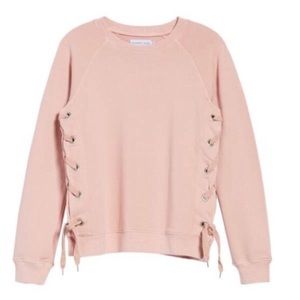 Sincerely Jules side lace up sweatshirt.